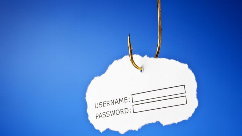 Amo a cui è attaccato un pezzo di carta che riporta username e password, a indicare i processi di autenticazione.